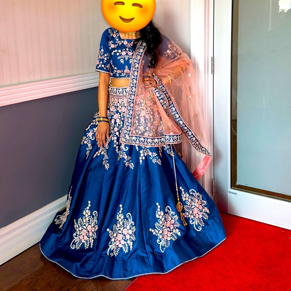 Blue raw silk Designer lengha with pink net duppata. Full flare.